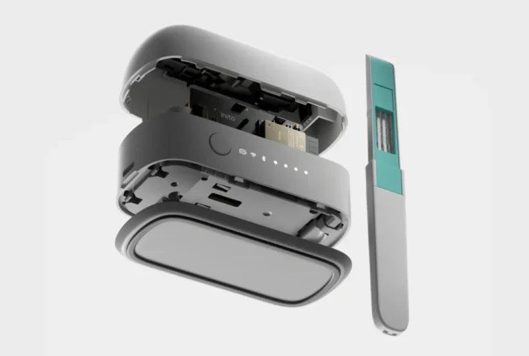 Exploded view of InSight Wireless Reader™ with a Fertility Strip on the side, and the device showing internal sensing components